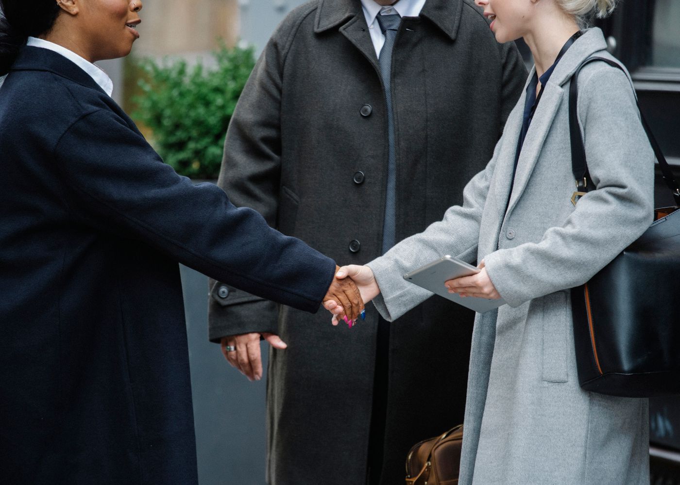 Advisor shaking hands with a client — the relationships our work is rooted in