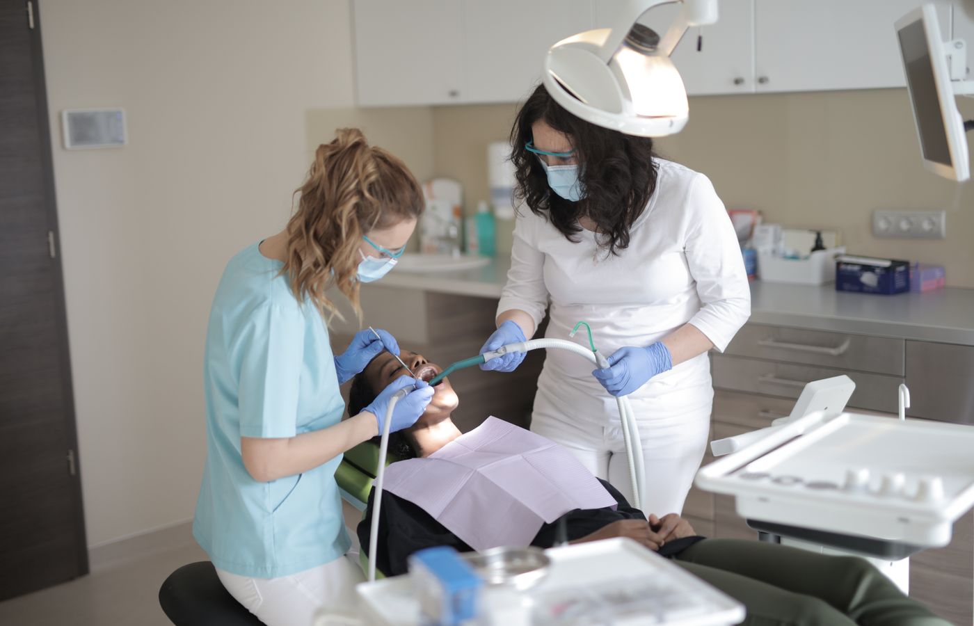 Dentist and assistant treating a patient at a dental practice — 36-employee dental group case study