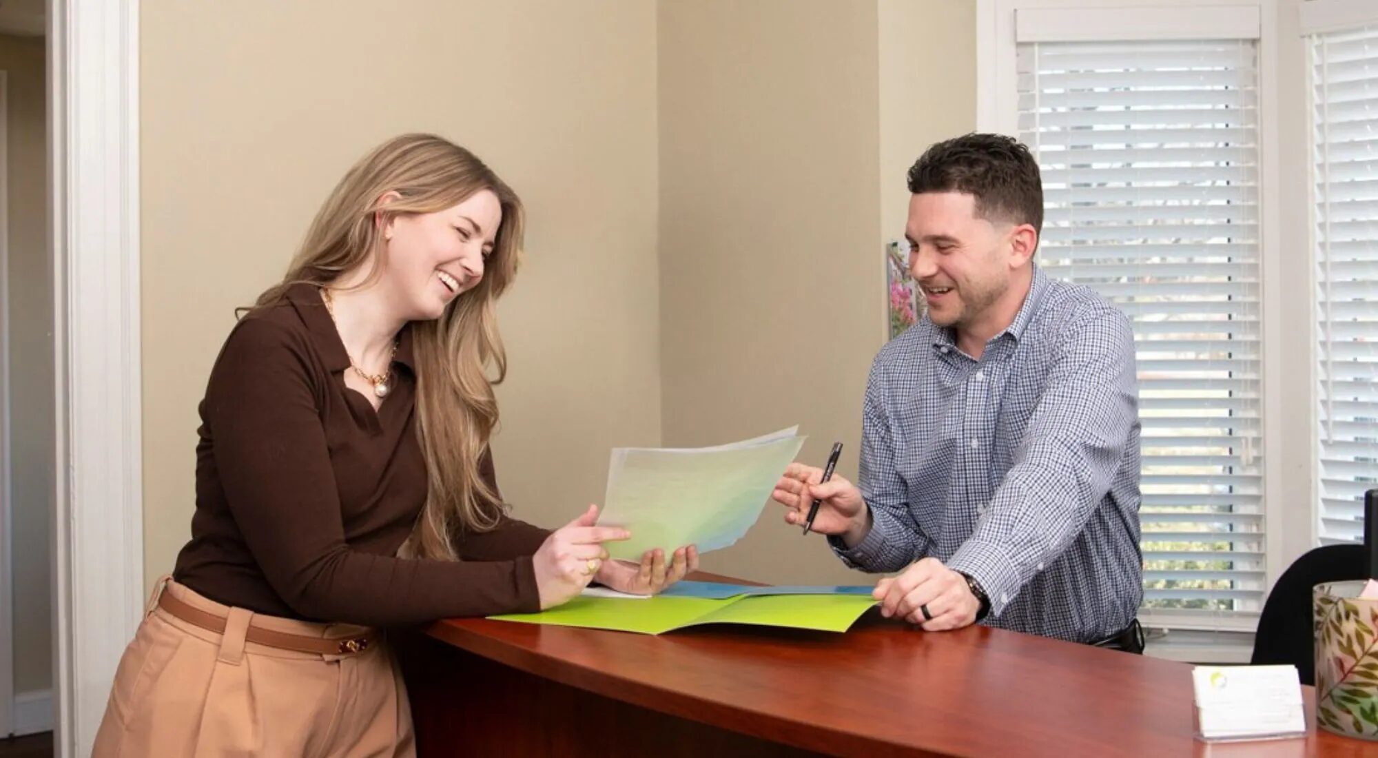 Philadelphia Life & Health advisor walking a client through enrollment paperwork