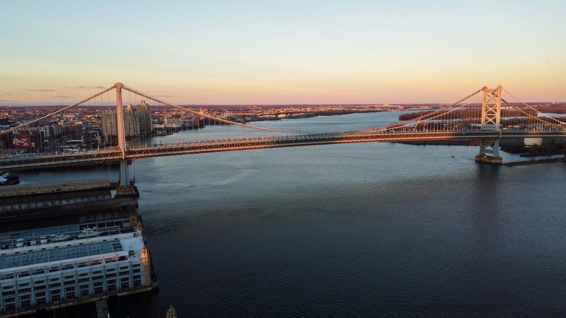Benjamin Franklin Bridge at sunset spanning the Delaware River in Philadelphia